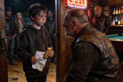 The Breaking Point The rain was coming down in sheets, the kind of storm that makes you want to lock the doors and forget the world exists. We were sitting in the clubhouse, just the usual crew, trying to drown out the thunder with cheap beer and old stories. Then the door didn’t just open—it exploded. This tiny, shivering figure stood there, looking like he’d been dragged through a river. He wasn’t crying, which was the scariest part. His eyes were wide, vacant, and he was clutching a granola bar so tight his knuckles were white. He looked at us—a room full of guys the rest of the world is afraid of—and he didn’t blink. He just asked a question that made the air leave the room.