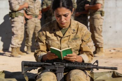 The chow hall was a roar of laughter and bravado, but I sat in the corner feeling like a ghost. I could hear them whispering from two tables over—”dead weight,” “quota sniper,” “paper shooter.” They thought I was just a girl playing dress-up in a Marine uniform, someone to carry the radios while the “real men” did the fighting. I gripped my green notebook, the one filled with wind charts and ballistic math they’d never understand, and felt a familiar, burning pressure in my chest. They had no idea that the very person they were mocking was the only one who saw the slaughter waiting for them in that valley.