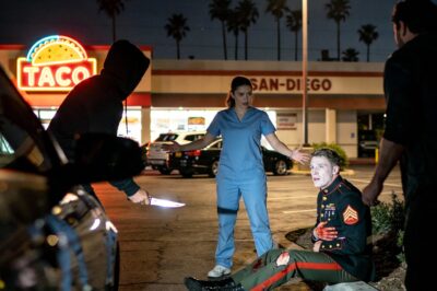 I Was Just an Exhausted EMT Buying Groceries When I Saw a Bleeding Marine Being Hunted by Gang Members—Minutes Later, I Was Bleeding Out on the Asphalt With 7 Stab Wounds Because I Refused to Step Aside and Let Them Finish Him Off.