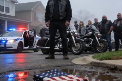 He looked me dead in the eye, the badge on his chest gleaming like a shield he thought made him invincible. “You’re disrupting the peace,” he sneered, even as the hearse sat idling behind us. I felt the heat rising in my neck, the decades of service screaming for me to react, but I held the line. Then his hands came up. The shove wasn’t just a physical move; it was a total violation of everything we were there to protect. When I saw that flag hit the wet pavement, something inside me snapped—a silent, heavy break that signaled there was no going back from this.