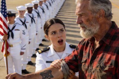 I felt like a grease stain on a wedding dress. Every direction I looked, it was blinding white Navy dress uniforms, crisp creases, and polished brass under the hot San Diego sun. And there I sat in the VIP section, sweating in a thick, faded red flannel shirt and work boots that had seen better decades. The looks I was getting could peel paint. They saw a confused old drifter who’d wandered onto the base. They didn’t see the grandfather waiting to watch his boy become a SEAL. I just kept my eyes forward, gripping the burning metal chair, trying to ignore the shame creeping up my neck.