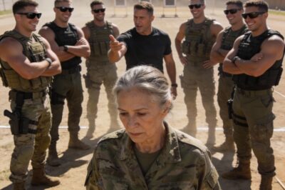 I watched as Lieutenant Commander Thorne laughed in her face. “You can hold the scope, Grandma,” he sneered, playing to the crowd of young, muscular SEAL candidates. They all snickered, a wall of arrogance surrounding this one quiet woman in a loose uniform. She didn’t yell. She didn’t fight back. She just stood there, looking small and fragile against the harsh Coronado sun. I wanted to scream at them to stop, to tell them they had no idea who they were mocking. But I stayed silent, and that silence is my biggest regret.
