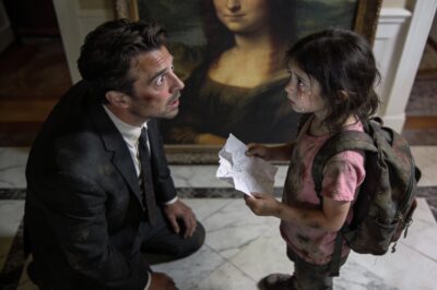 My guards froze. They knew the rules: no one enters without permission. Especially not a child. But there she stood, eight years old, wearing a torn backpack and shoes that were falling apart. She didn’t look scared. She looked determined. She looked past me, past the men with weapons, and stared directly at the massive portrait hanging above the fireplace. The room went dead silent. Then, her small voice shattered my entire world with one question: “Sir, why is my mom’s picture in your house?”