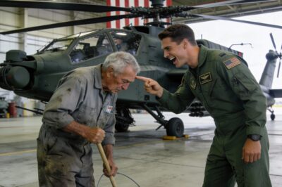 THE OLD JANITOR THEY MOCKED: How a $64 Million Apache Helicopter, a Dirty Mop, and a pair of Hidden Wings Exposed the Arrogance of a Captain Who Thought He Knew It All, Only to Be Crushed by the Legend Standing Right in Front of Him in a Hangar Full of Silence and Shame.