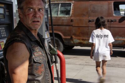 Three steps behind him, a girl followed. She was small, with tangled brown hair and a plain white t-shirt that hung too large on her thin frame. Her jeans were dirty, her sneakers untied, and she walked with her head down, like she was trying to disappear.