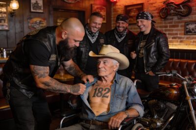 The moment he ripped my shirt open, the entire diner went silent. He thought he was intimidating a helpless old man in a wheelchair. He saw the gray hair and the paralyzed legs and assumed I was prey. He didn’t know that the ink on my chest wasn’t just a decoration—it was a warning label. He laughed at the number “182” etched into my skin, asking if it was how many beers I’d drank. He was about to find out that some numbers are earned in places nightmares are made of. And he was standing way too close to the fire.